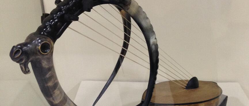 An ancient bow harp resembles an antelope with curved tusks.