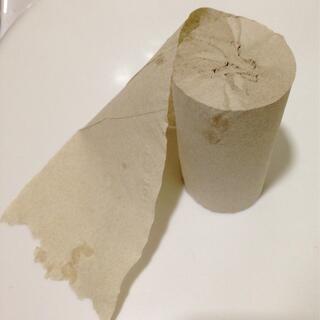 A tightly wound roll of tough brown toilet paper.