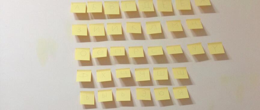 35 yellow sticky notes on the wall above my work desk.