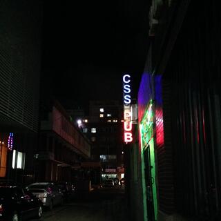 A neon sign reads 'CSS PUB'.