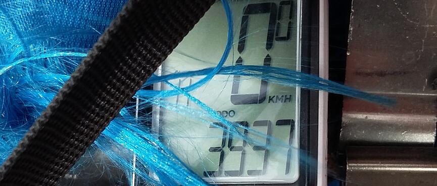 A digital bike odometer reads 3937.