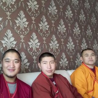I sit with three monks in a cafe.