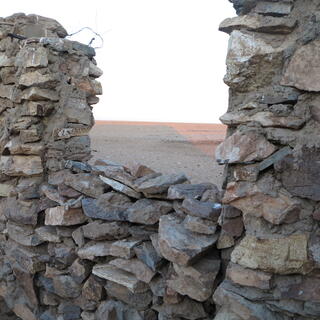 Cemented layers of rocks form the buildingʼs walls.