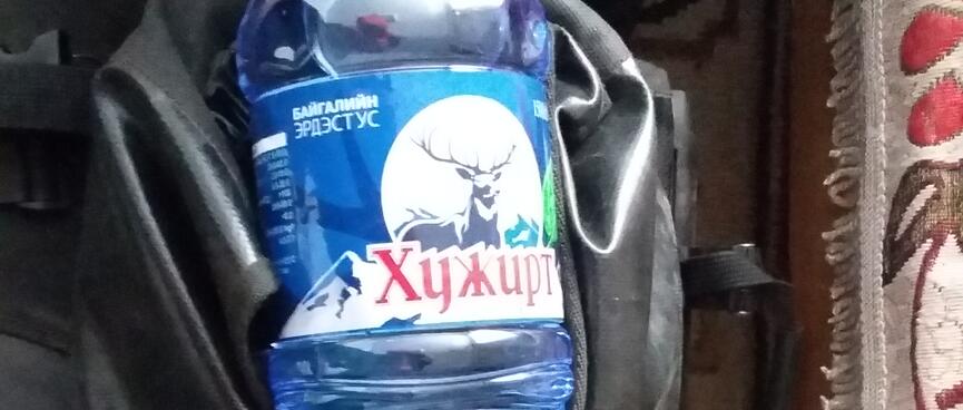 A blue 1.5L water bottle branded with a reindeer.