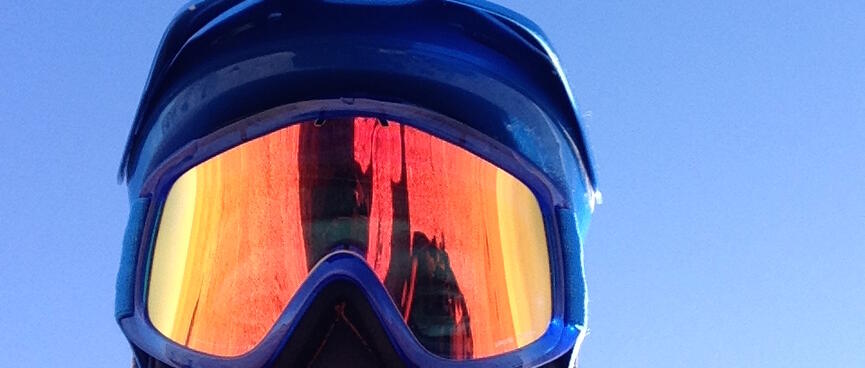 Close up of my head, which is covered in my POC helmet and orange mirrored goggles.