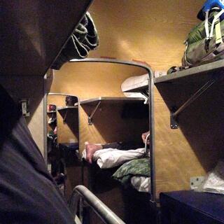 Fold down beds are stacked in the carriage corridors.