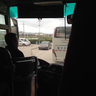 Our tour bus driver negotiates traffic.