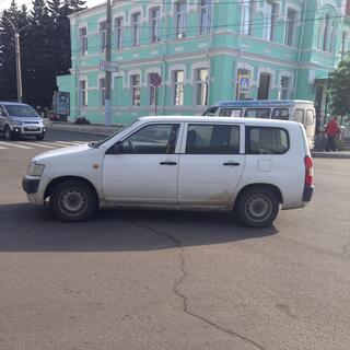 A car is parked in the middle of the road, in Chita.