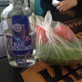 Half a bottle of vodka and a bag of tomatoes and cucumbers.