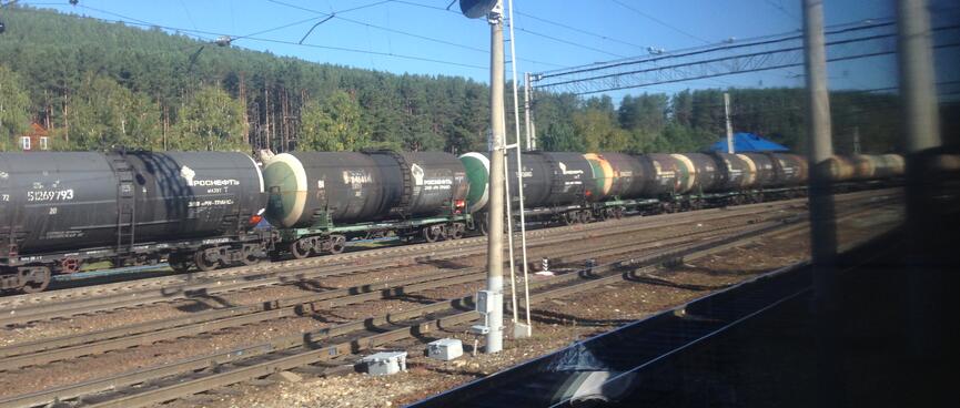 A long line of cylindrical wagons.