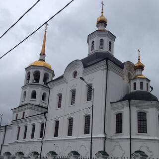 Golden spikes adorn the towers of a white church in old Irkutsk.