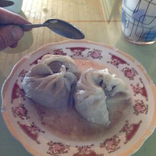 Large dumplings in a thin soup.