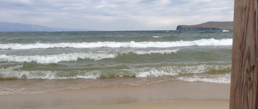 Waves break on the sandbar.