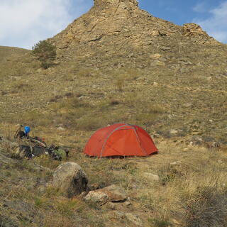 The tent and behind it the rocky knoll.