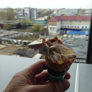 A city view and a half eaten ice-cream.