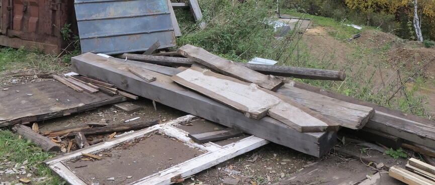 A messy pile of timber and iron.