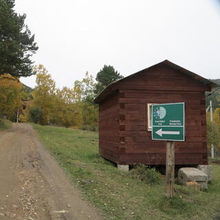 A large sign next to the trail.