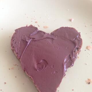 A heart shaped cake with chocolate icing.